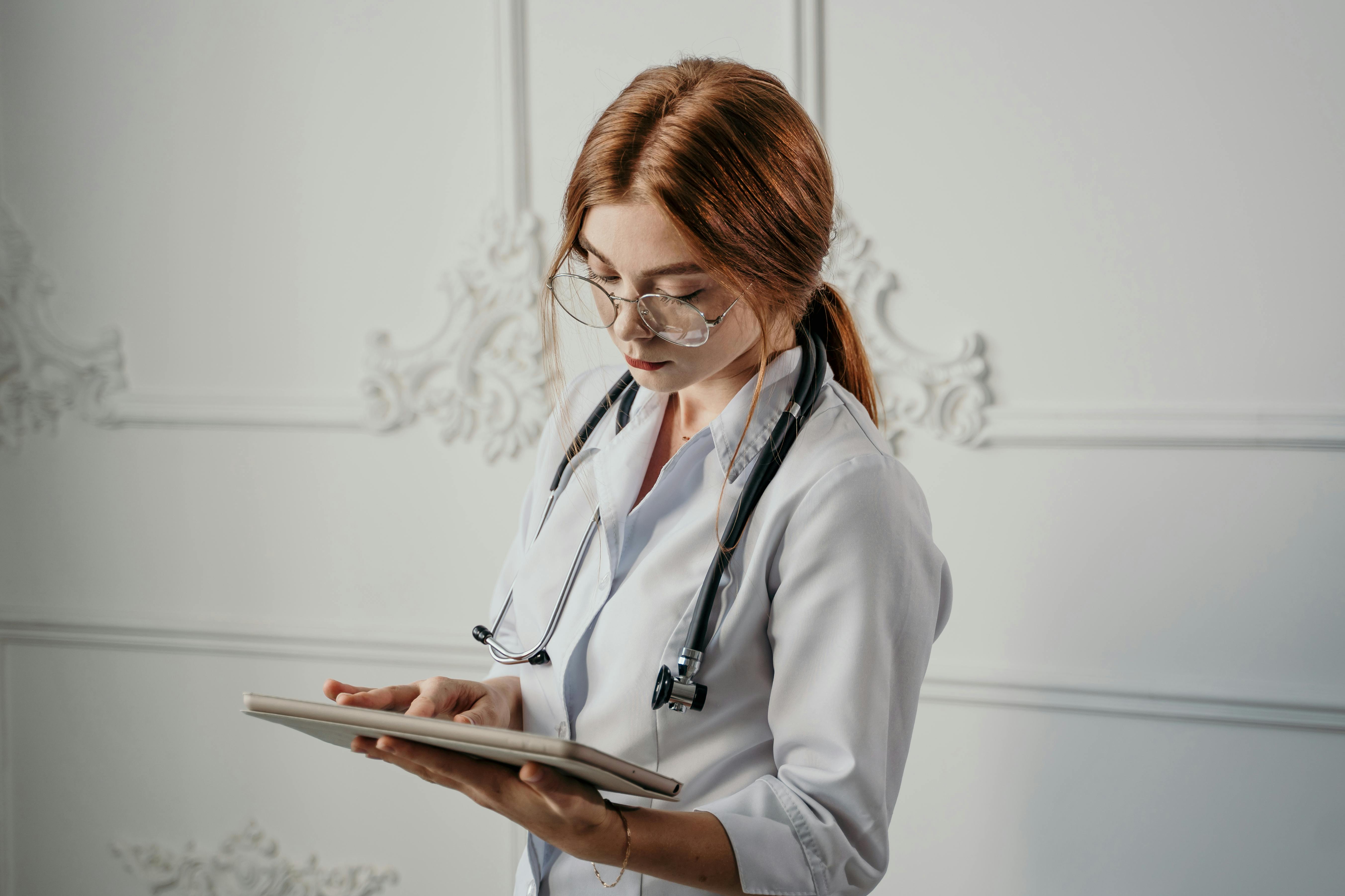 Doctor looking at tablet